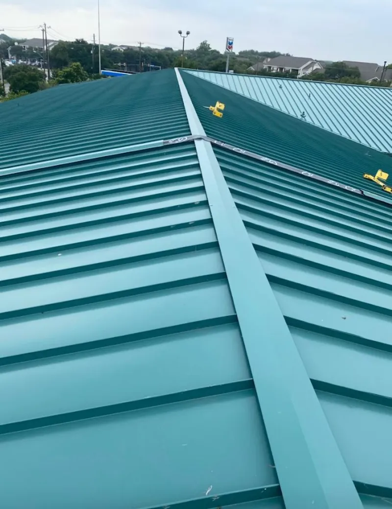 Green commercial metal roof ridge and valley for Metal Roof Repair in Argyle