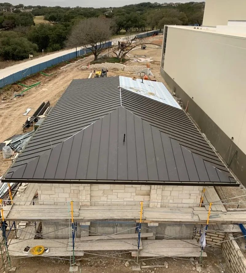 Metal roof new construction with scaffolding in Argyle