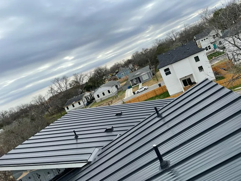 Standing seam metal roof panels with vents for Skylight Repair in Argyle
